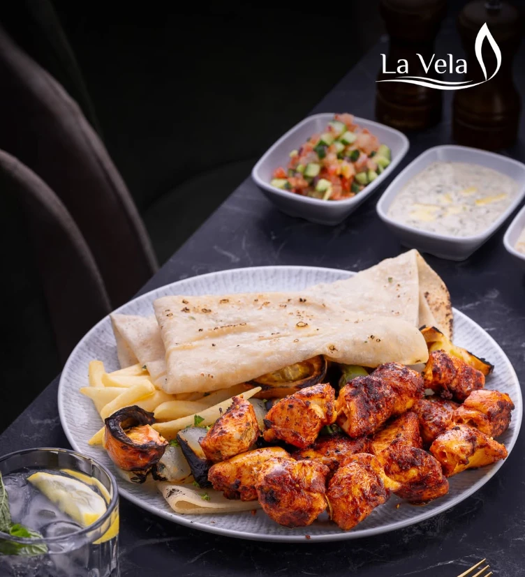 Mixed grill platter with bread and dips